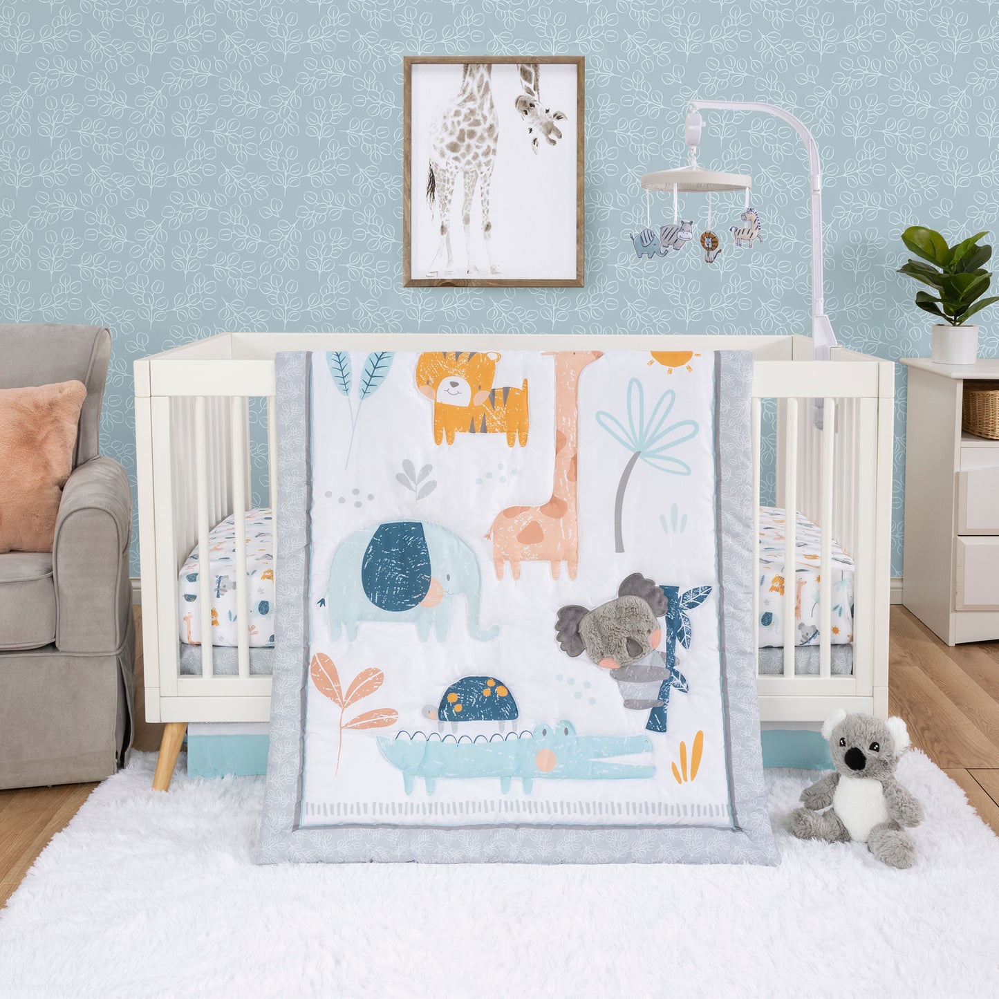 Koala & Friends 4 Piece Bedding Set by Sammy & Lou® - stylized room. This design features a sweet appliqued plush Koala surrounded by friends. The soft colors of yellow, orange, teal and blue will surely add style to any little one's nursery.
