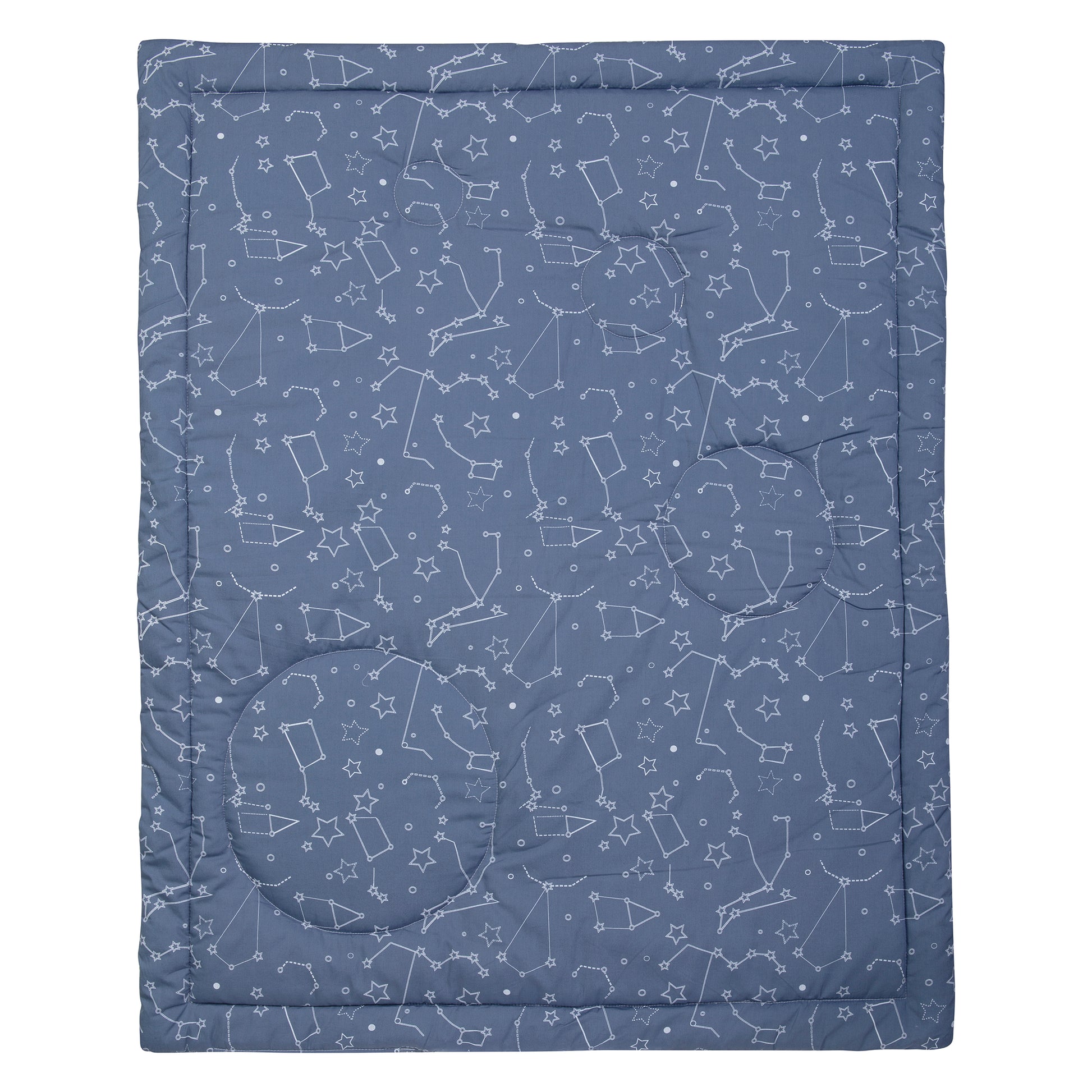 Reversible 100% cotton quilt measures 35 in x 45 in and features rocket ships scatter print with planet appliques bordered by solid and star constellations in navy blue, gray, white with pops of yellow. Quilt is backed in star constellations in navy blue 