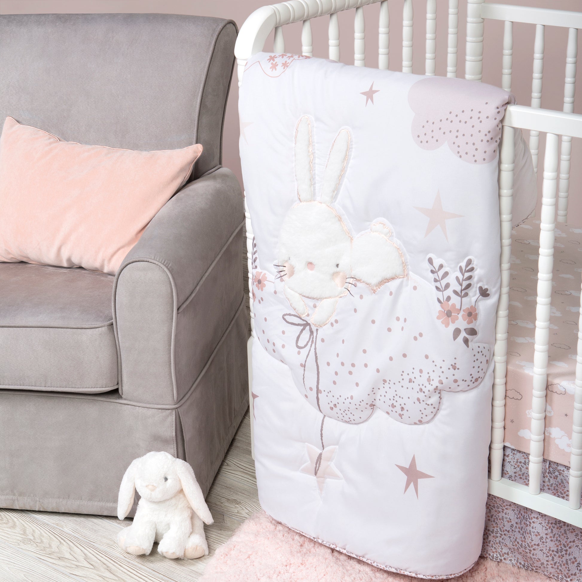 Cottontail Cloud 4 Piece Crib Bedding Set stylized image; in room features a crib quilt and plush bunny by Sammy & Lou®