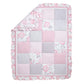 Emma 4 Piece Crib Bedding Collection by Sammy and Lou ; nursery quilt with folded corner. measures 35 in x 45 in and features a patchwork of a beautiful floral print, stripes of hearts, mini-dots and solid patches in a color palette including ballerina pi