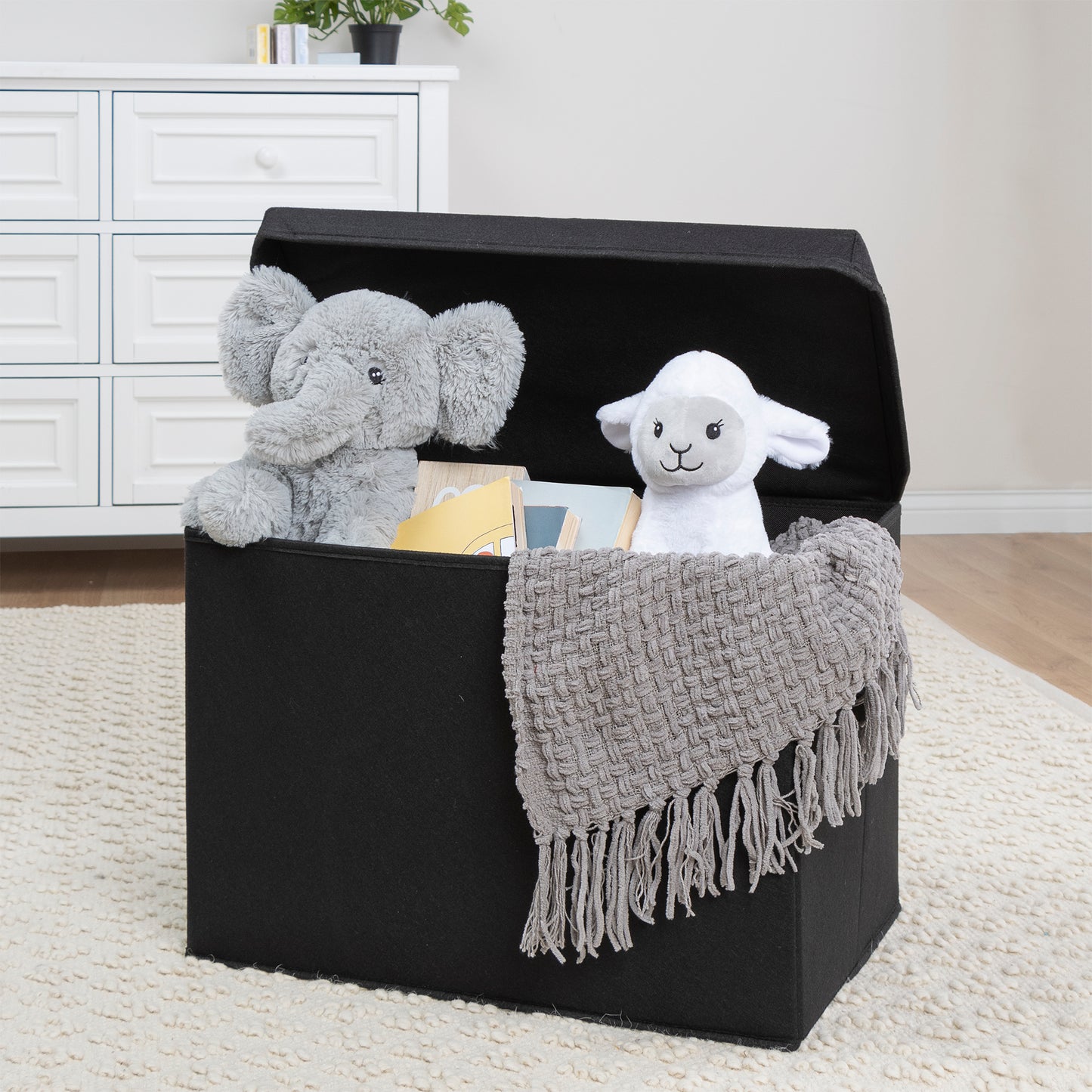 Black Felt Toy Box by Sammy & Lou® with lid open with toys and stuffed animals peeking out
