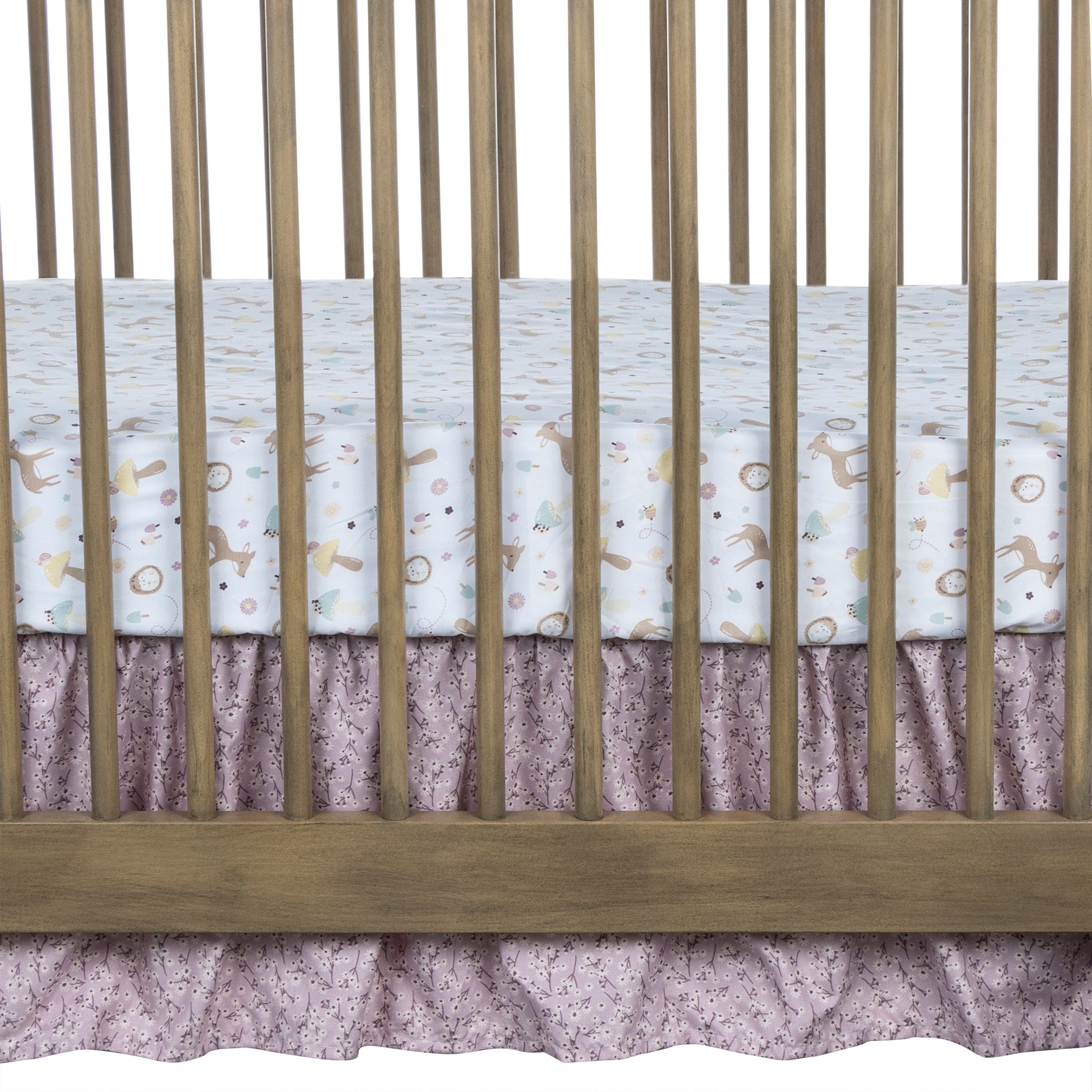 Enchanted Garden 4 Piece Crib Bedding Set by Sammy & Lou®; crib skirt features a lilac floral scatter print.