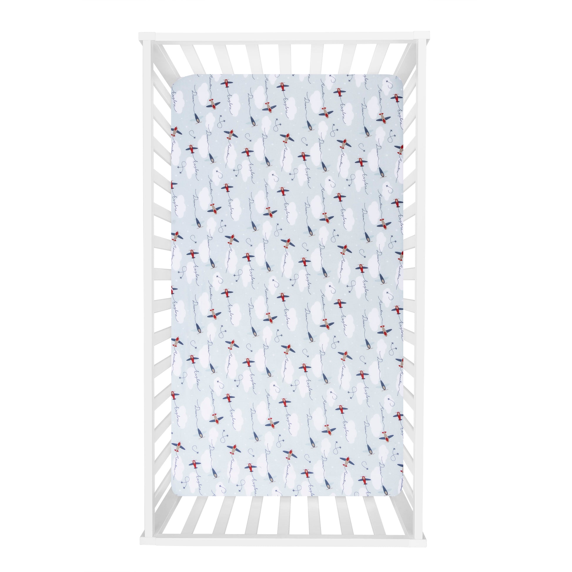 Air Travel 3 Piece Crib Bedding Set by Sammy & Lou® - overhead view of crib sheet with blue background, red and navy airplane scatter print and clouds