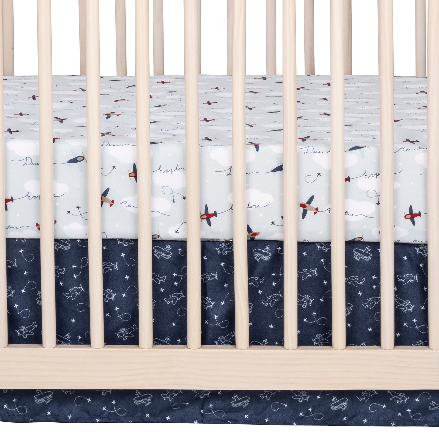 Air Travel 3 Piece Crib Bedding Set by Sammy & Lou® - zoomed in view of crib sheet and crib skirt on a crib