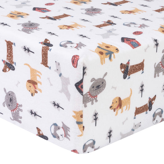 Dog Park Deluxe Flannel Crib Sheet - Corner View; eatures a sketched multi-breed puppy print with dog houses and bones in gray, red, light blue and a variety of browns on a white background.