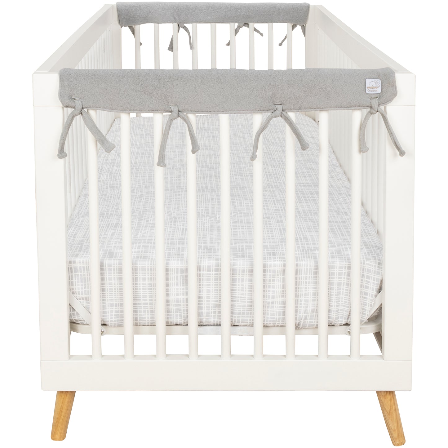 CribWrap® Narrow 2 Short Gray Fleece Rail Covers on a white crib