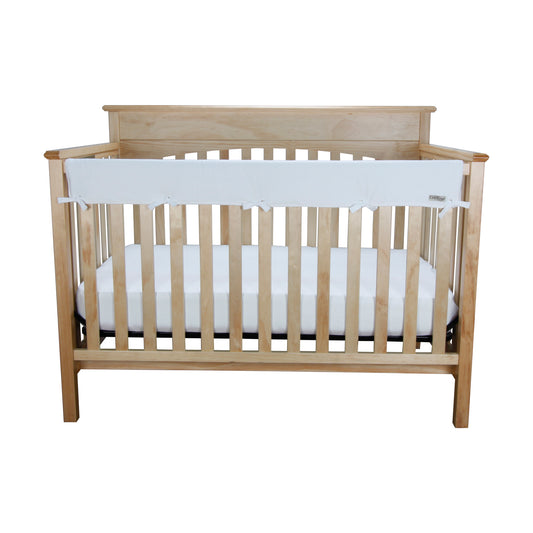 CribWrap® Medium 1 Long White Jersey Rail Cover on wood crib