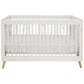 CribWrap® Narrow 1 Long White Fleece Rail Cover on a white crib