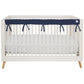 CribWrap® Narrow 1 Long Navy Fleece Rail Cover on a white crib