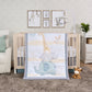 Safari Babies 4 Piece Bedding Set by Sammy and Lou® in a stylized bedroom. This design features a baby elephant, rhino and giraffe with touches of leaves and herringbone print designs.