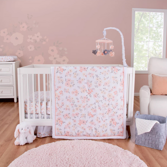 Blush Floral 3 Piece Crib Bedding Set in a stylized bedroom.